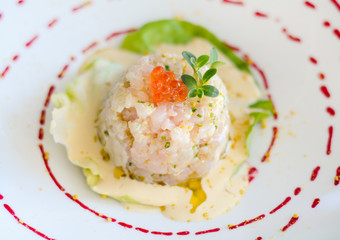 Fish carpaccio with sauce and caviar