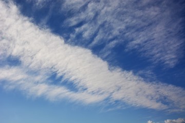 White clouds in a clear blue sky