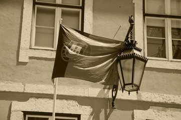 Portugal flag on the house in the city center of Lisbon. Sepia photo. 