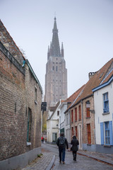 Obraz premium Bruges, Belgium on November 25, 2018: Medieval architecture and channels in Bruges the largest city of the province of West Flanders in the Flemish Region of Belgium.