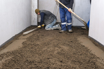 builders poured concrete at the construction site