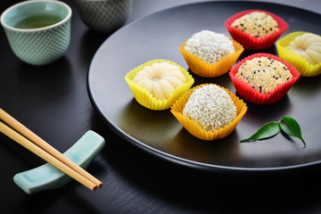 Mochi assortment on plate with chopticks