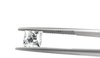 Diamond in Tweezers on White Background