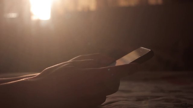 A Girl Typing on her Mobile Phone