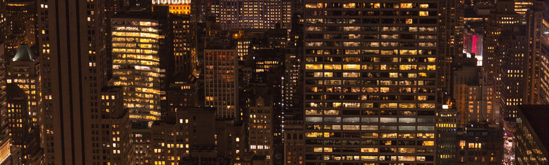 Fototapeta na wymiar panoramic view of buildings and night city lights in new york, usa