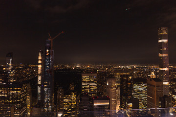 aerial view of buildings and night city lights in new york, usa