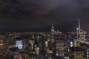 aerial view of buildings and night city lights in new york, usa