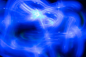 Obraz premium blue neon abstract background image. Drawing with light, motion blur