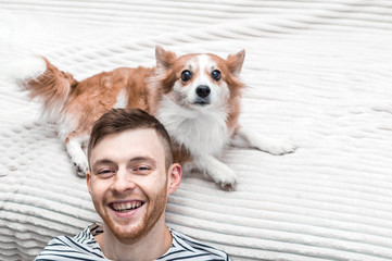 Happy man and dog. Closeup portrait. Concept dog in the apartment