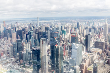 Fototapeta na wymiar aerial view of new york city skyscrapers and cloudy sky, usa