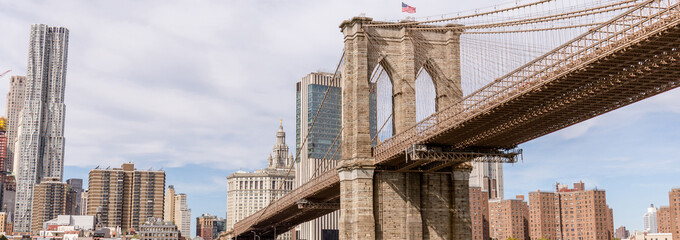 panoramic view of brooklyn bridge and manhattan in new york, usa