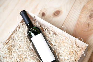 bottle of red wine in a wooden box