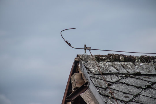 Lightning rod on the roof of an old house