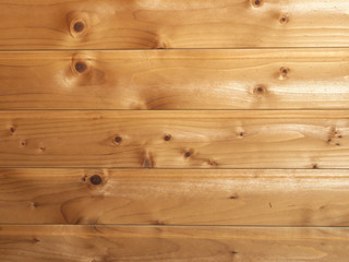 light yellow pine boards with small knots and cracks, background image