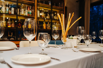 Wine glasses in a restaurant setting. Serving on the table. Crystal glasses for catering