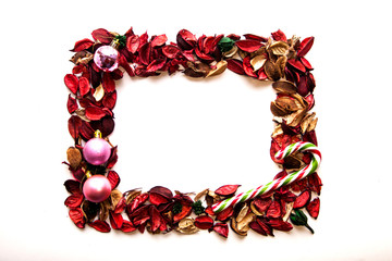 frame from red rose petals and Christmas ornaments