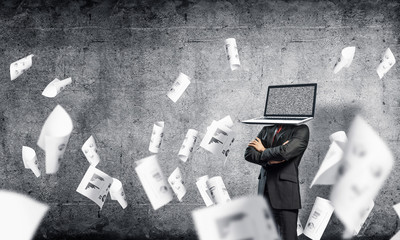 Businessman with laptop instead of head.