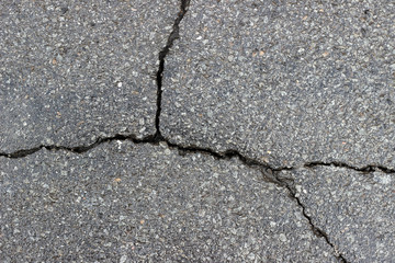 Obraz premium Asphalt wet crack fracture surface texture