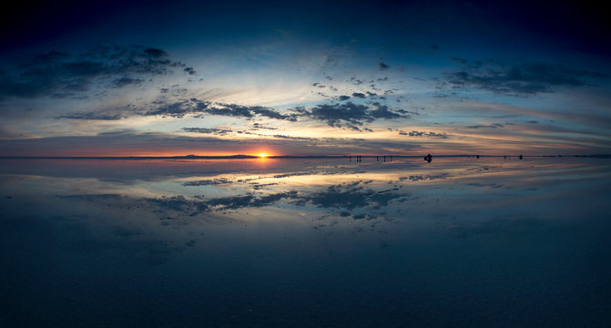 Panoramic sunrise over Salar de Uyuni, Bolivia, with water reflection - Powered by Adobe