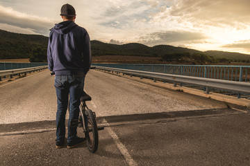 Guy with a bmx bike. BMX rider. Extreme urban sports concept