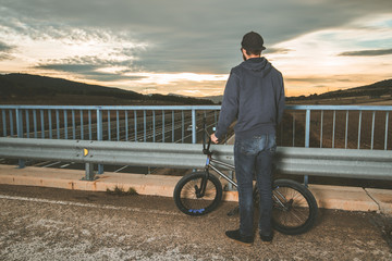 Guy with a bmx bike. BMX rider. Extreme urban sports concept