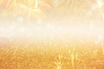 abstract golden sparkling and fireworks background with space for text