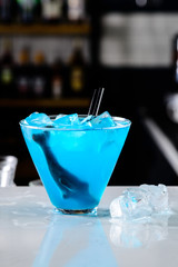 blue shark cocktail, bar counter with copy space