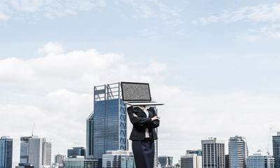 Business woman with laptop instead of head.