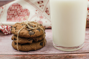 freshly baked chocolate chip cookies on rustic wooden table