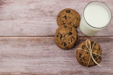 freshly baked chocolate chip cookies on rustic wooden table