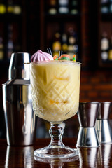 yellow cocktail on bar background, night club scenery. Restaurant menu with copy space