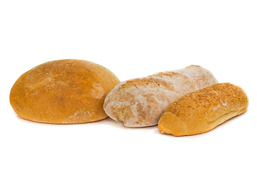 a loaf of white bread, buns and a baguette on a white background