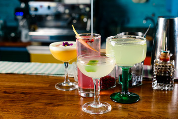 set of Classic alcoholic cocktails on bar counter in pup or restaurant with copy space