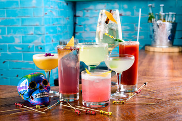 set of Classic alcoholic cocktails on bar counter in pup or restaurant with copy space