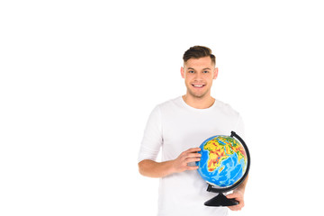 smiling young man holding globe isolated on white