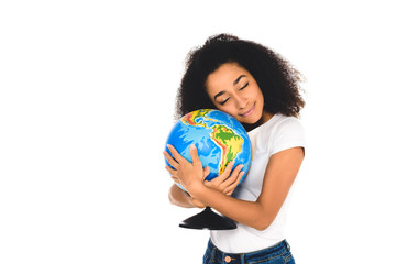 curly african american girl hugging globe isolated on white
