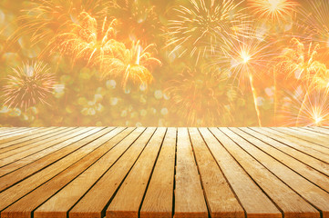 fireworks background with wooden table top for celebration design to gold color style