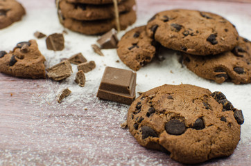 freshly baked chocolate chip cookies on rustic wooden table