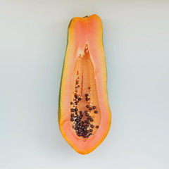 Ripe papaya half isolated on the white background