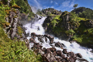 Naklejka na ściany i meble There are hundreds of beautiful waterfalls in Scandinavia