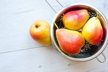 Pears on the wooden table.
