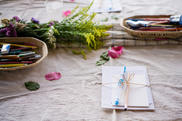 drawing set with flowers on wooden table
