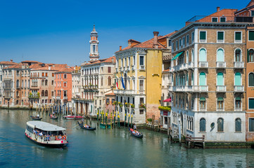 Fototapeta na wymiar Water transportation and colorful historic buildings of Venice