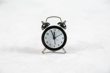 Retro alarm clock on white background.