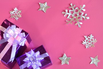 Colorful gifts box on pink background