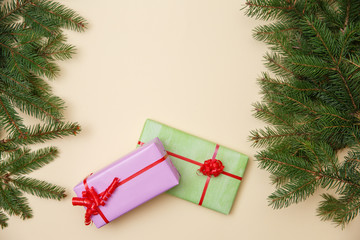 Christmas tree and gifts on wooned background.