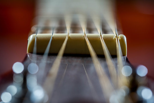 Classic guitar strings in soft focus close up macro shot, image for background.