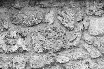 Old grunge stone background. Horizontal black and white color photography.