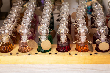 several glass jars of perfumes