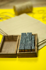 mini stamps and packaging bags for applying the brand on a yellow background